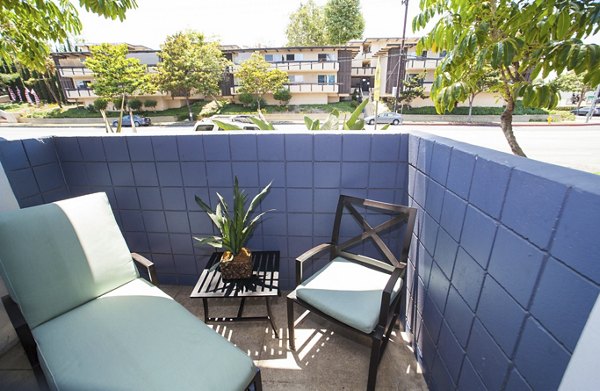 Chic outdoor patio with modern seating at Milano Apartments