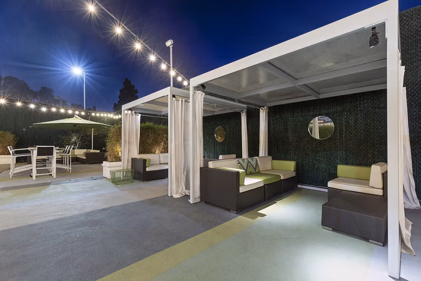 Milano Apartments: Tranquil courtyard with lush greenery and seating areas