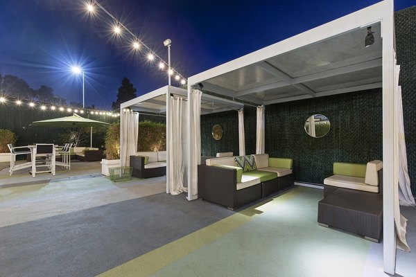 Milano Apartments: Tranquil courtyard with lush greenery and seating areas
