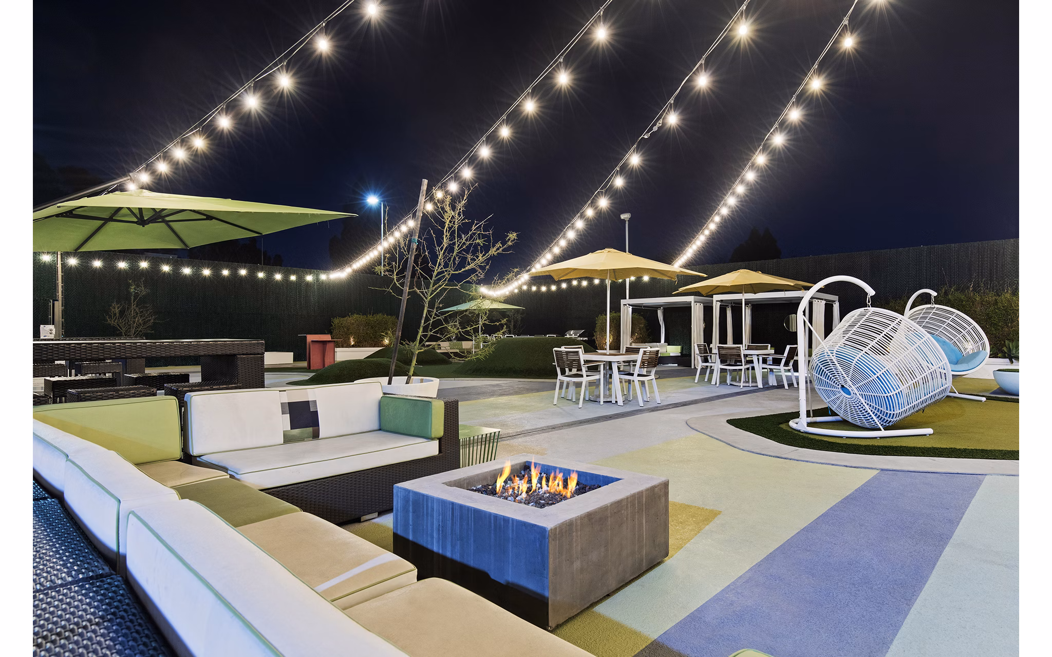 Serene courtyard with lush landscaping at Milano Apartments