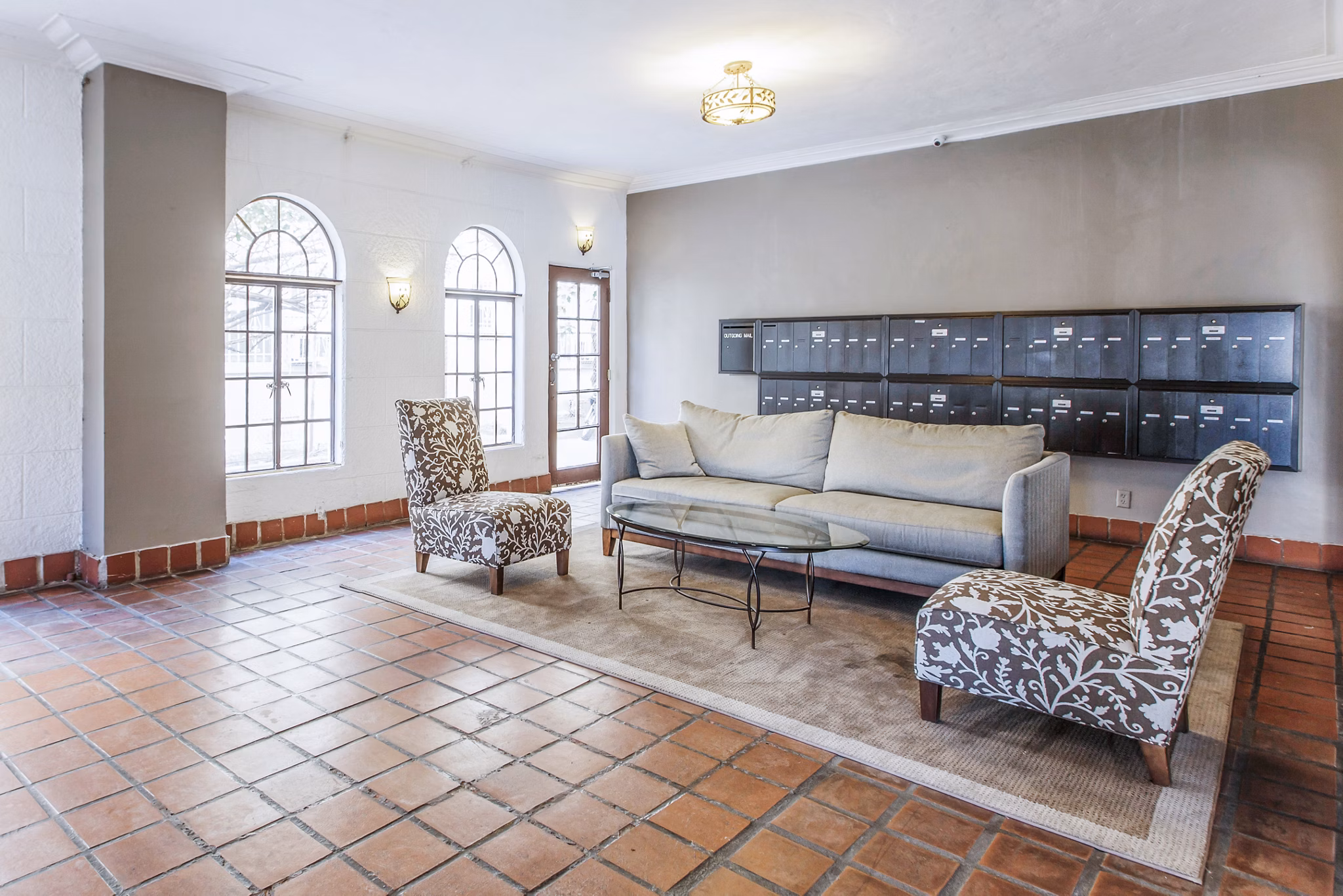 Modern clubhouse mail room at North Kingsley Apartments with secure package lockers and ample lighting for residents