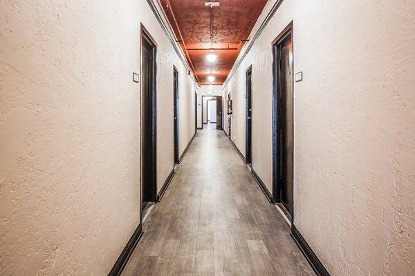 North Kingsley Apartments: Elegant hallway with modern lighting and hardwood floors