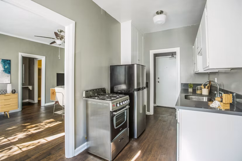 Modern kitchen with sleek cabinetry and stainless steel appliances at North Kingsley Apartments, offering luxury living spaces for residents