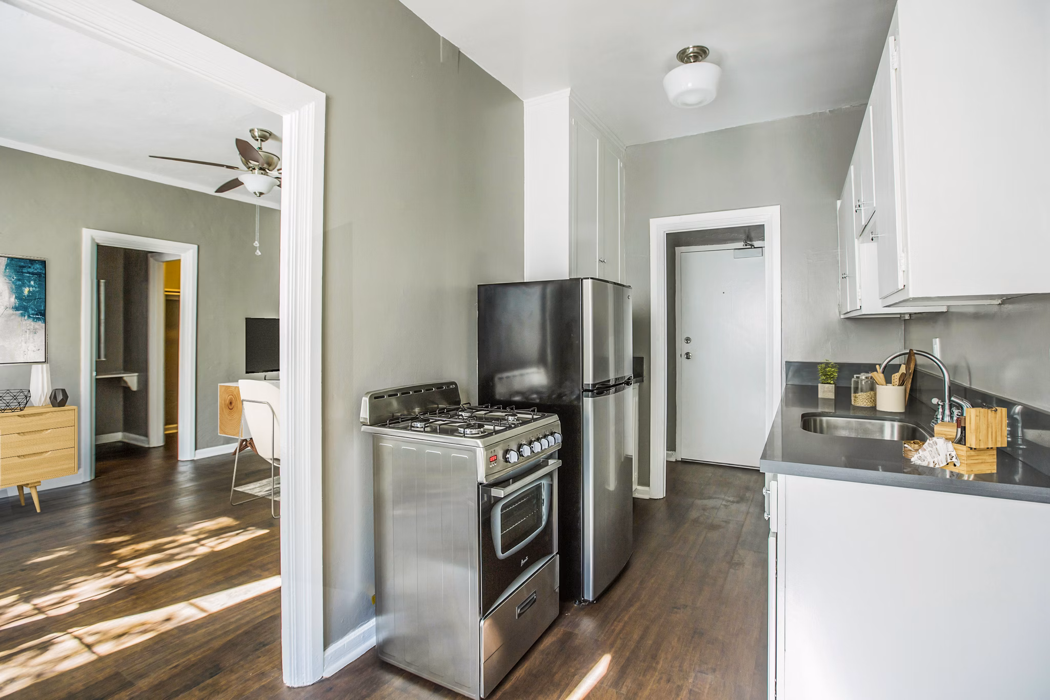 Modern kitchen with sleek cabinetry and stainless steel appliances at North Kingsley Apartments, offering luxury living spaces for residents