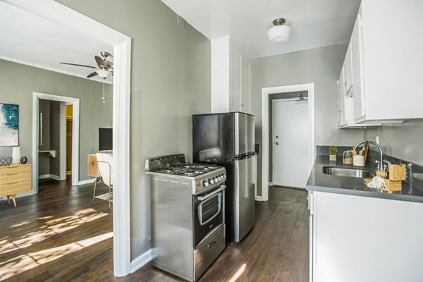 Modern kitchen with sleek cabinetry and stainless steel appliances at North Kingsley Apartments, offering luxury living spaces for residents