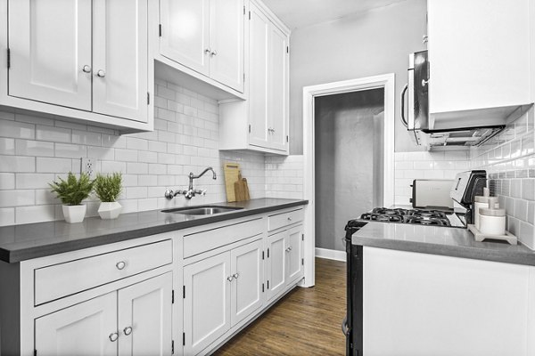 Modern kitchen with stainless steel appliances at North Kingsley Apartments
