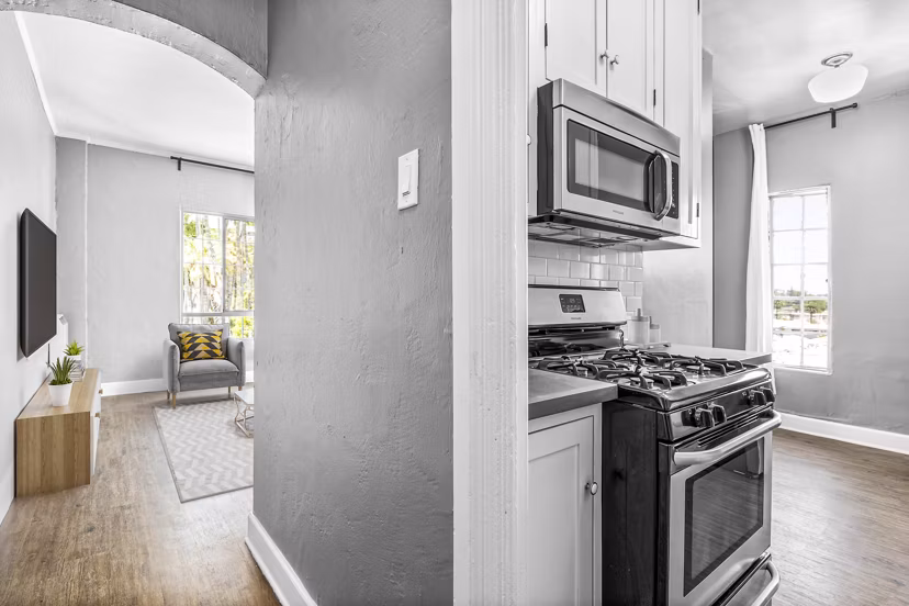 Contemporary kitchen with stainless steel appliances at North Kingsley Apartments