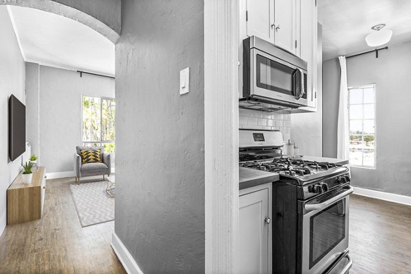 Contemporary kitchen with stainless steel appliances at North Kingsley Apartments