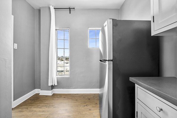 Modern kitchen with sleek countertops and stainless steel appliances at North Kingsley Apartments