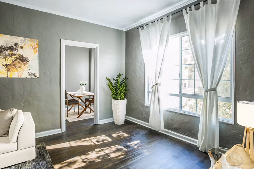 Spacious living room with modern dÃ©cor at North Kingsley Apartments, a luxury property by Greystar