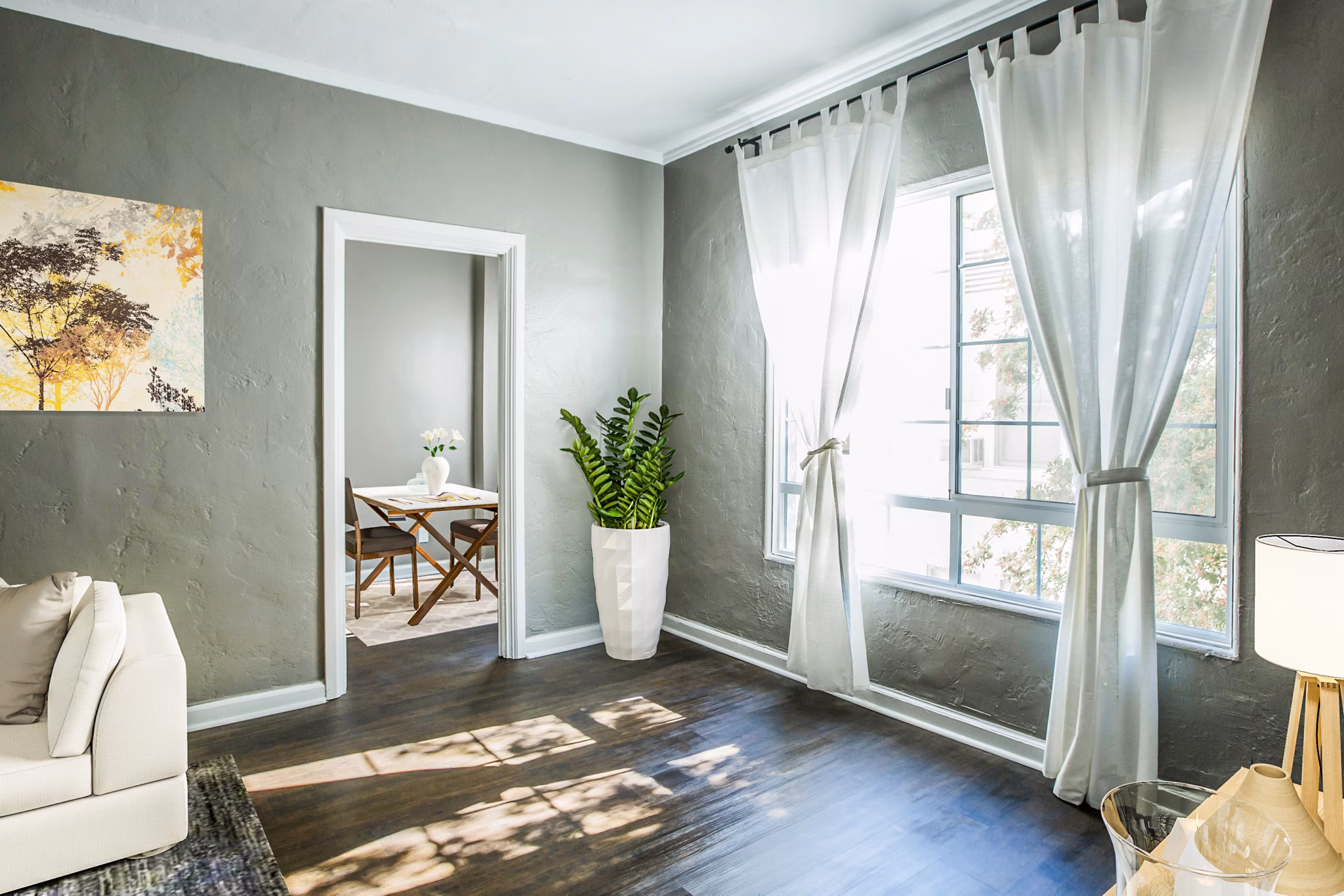 Spacious living room with modern dÃ©cor at North Kingsley Apartments, a luxury property by Greystar