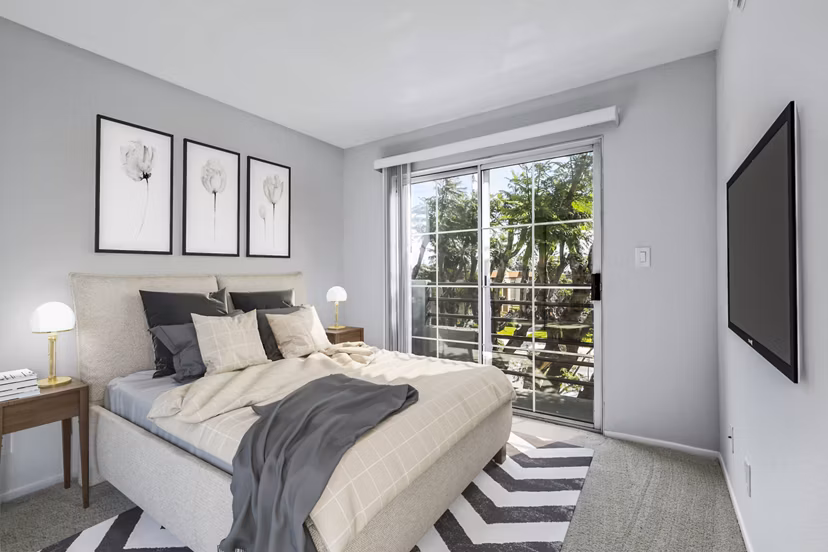 Nova Townhomes Apartments: Modern bedroom with cozy decor and large windows in luxury apartments