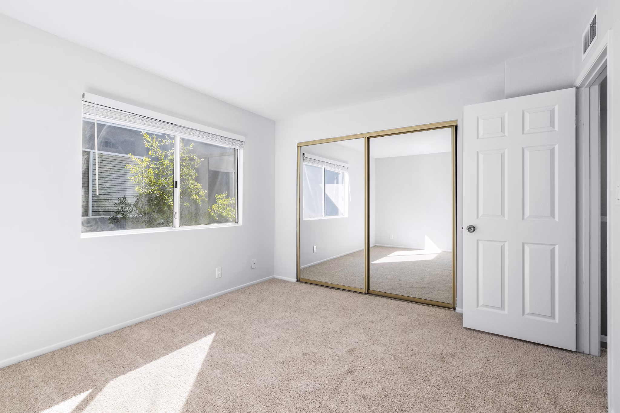 Nova Townhomes: Inviting bedroom with modern decor and ample storage in luxury apartments