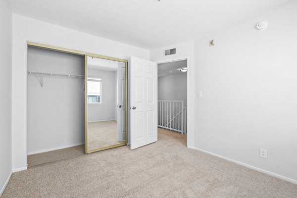 Cozy bedroom with modern design in Nova Townhomes Apartments
