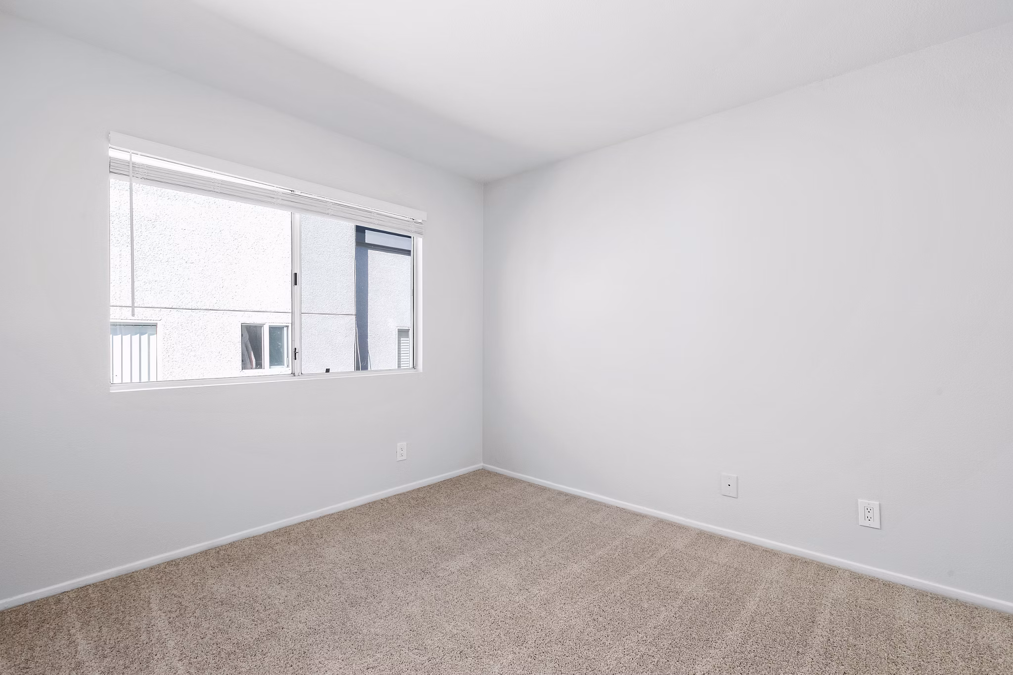 Cozy bedroom with contemporary furnishings at Nova Townhomes Apartments