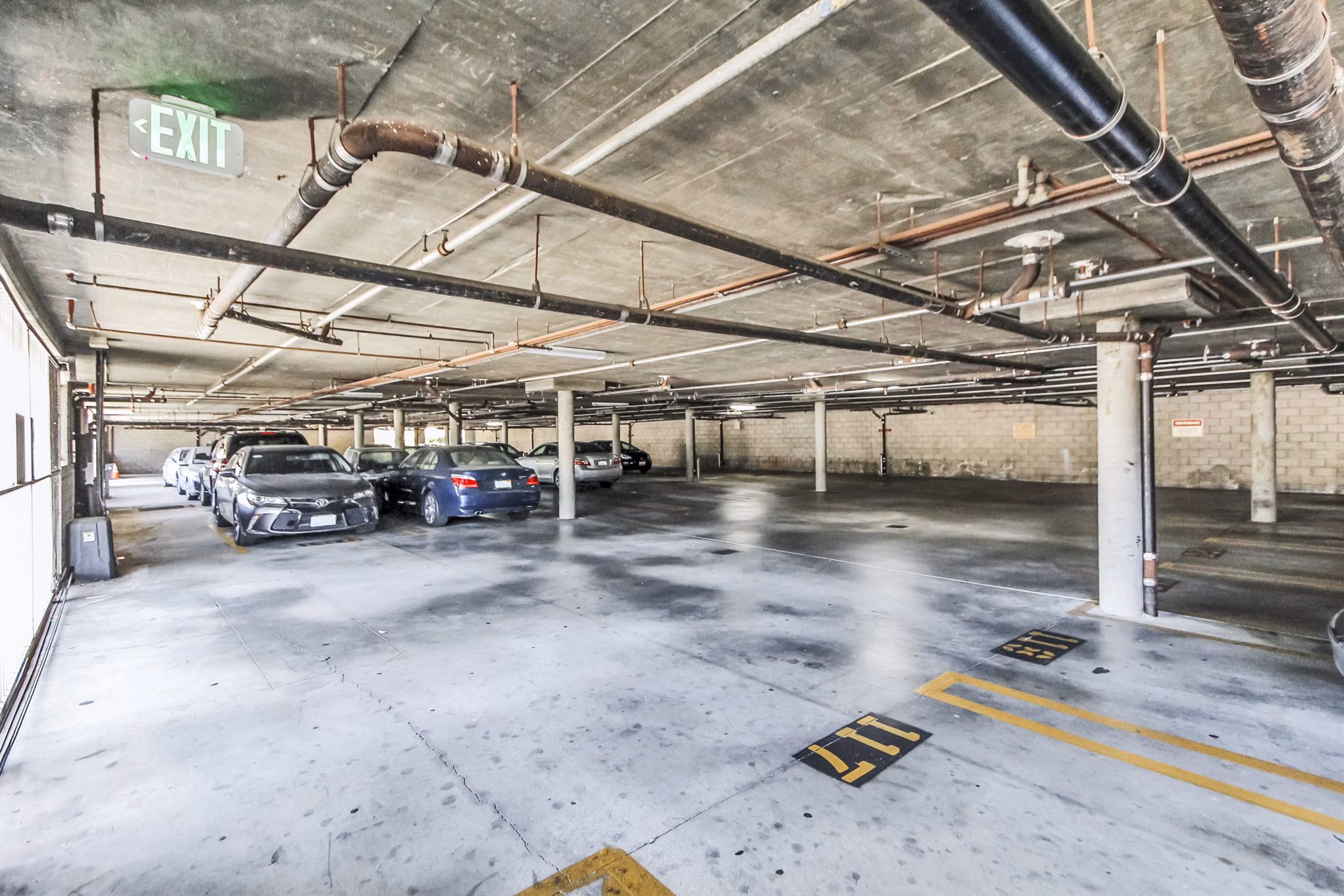 Covered parking garage at Nova Townhomes Apartments offering convenient and secure vehicle storage for residents