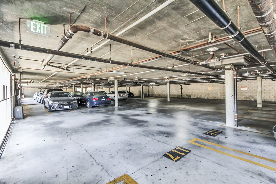 Covered parking garage at Nova Townhomes Apartments offering convenient and secure vehicle storage for residents