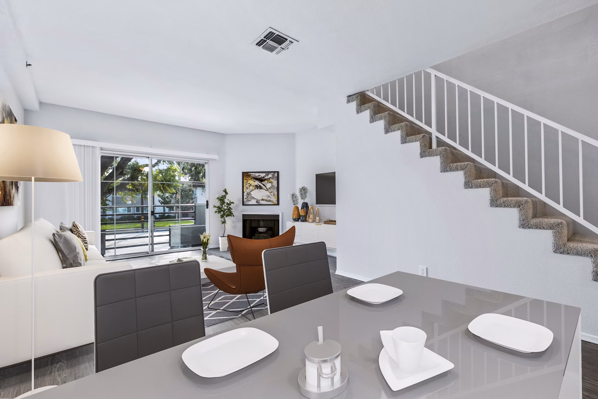 Dining room with modern decor and ample natural light in Nova Townhomes Apartments