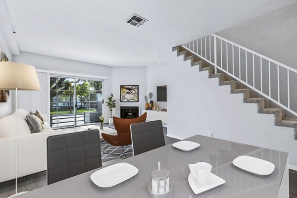 Dining room with modern decor and ample natural light in Nova Townhomes Apartments