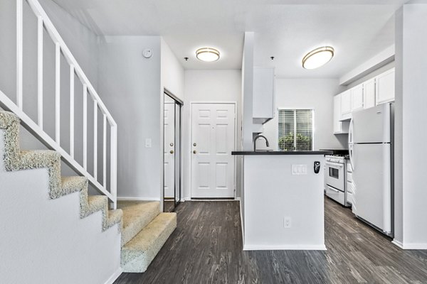 Contemporary kitchen with stainless steel appliances at Nova Townhomes Apartments