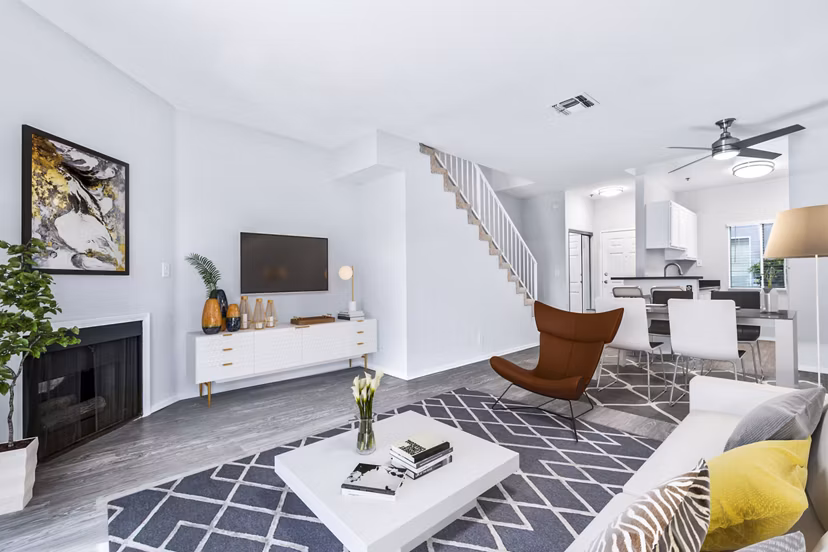 Spacious living room with modern decor in Nova Townhomes Apartments