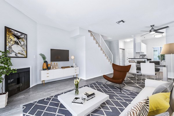 Spacious living room with modern decor in Nova Townhomes Apartments