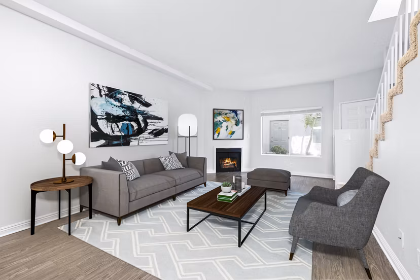 Spacious living room with contemporary design elements in Nova Townhomes Apartments