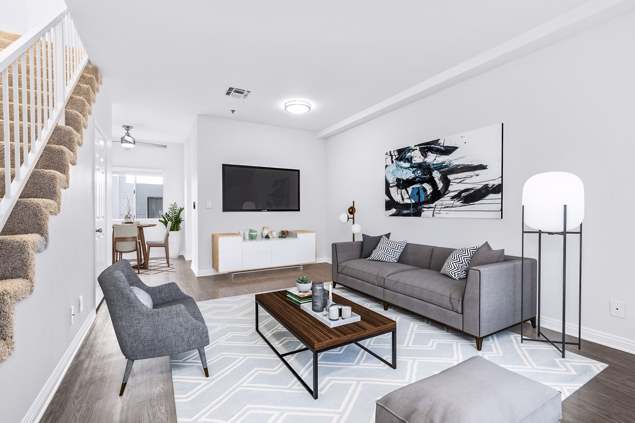 Spacious living room with stylish furnishings in Nova Townhomes Apartments