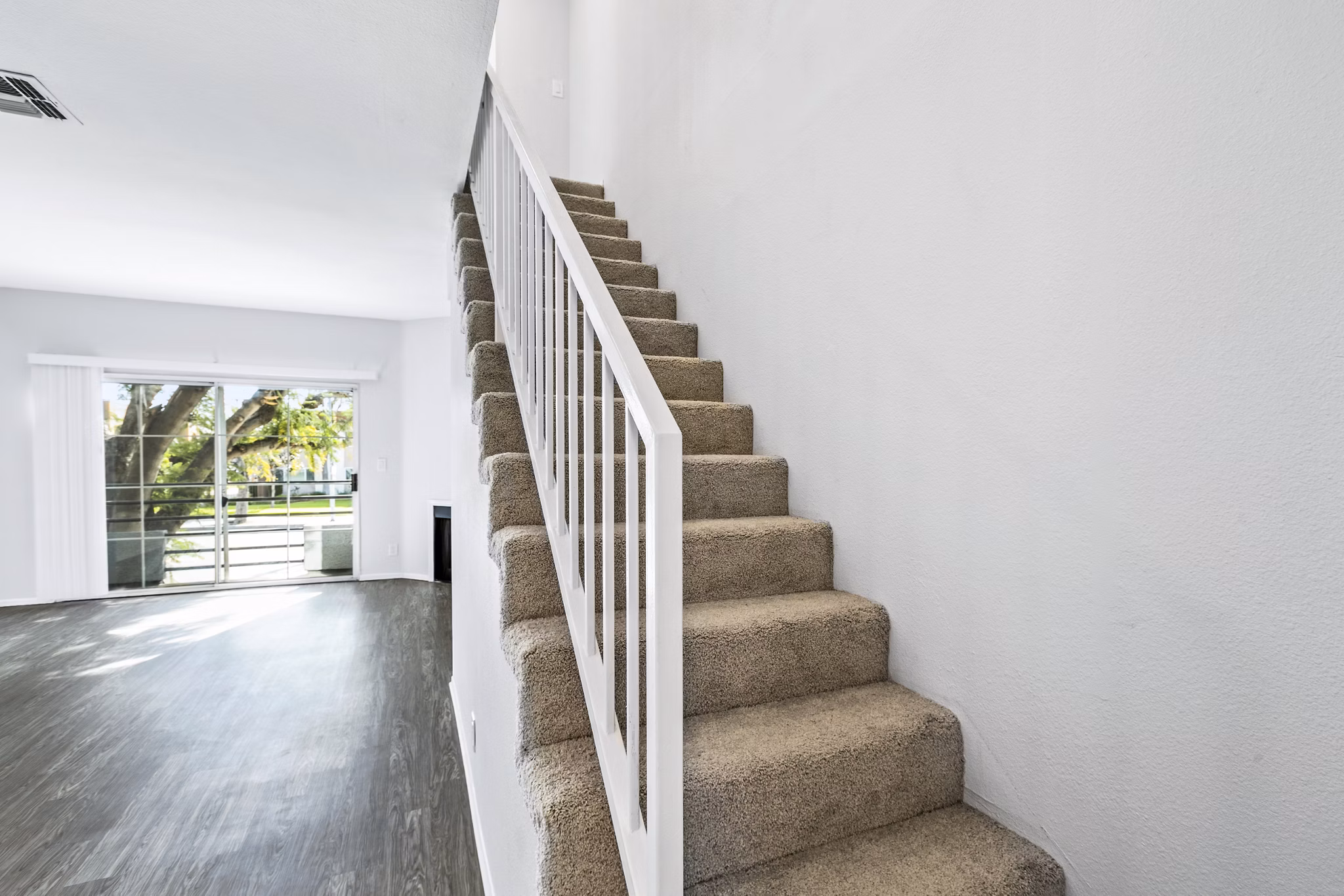 Nova Townhomes Apartments: Elegant hallway with modern staircase