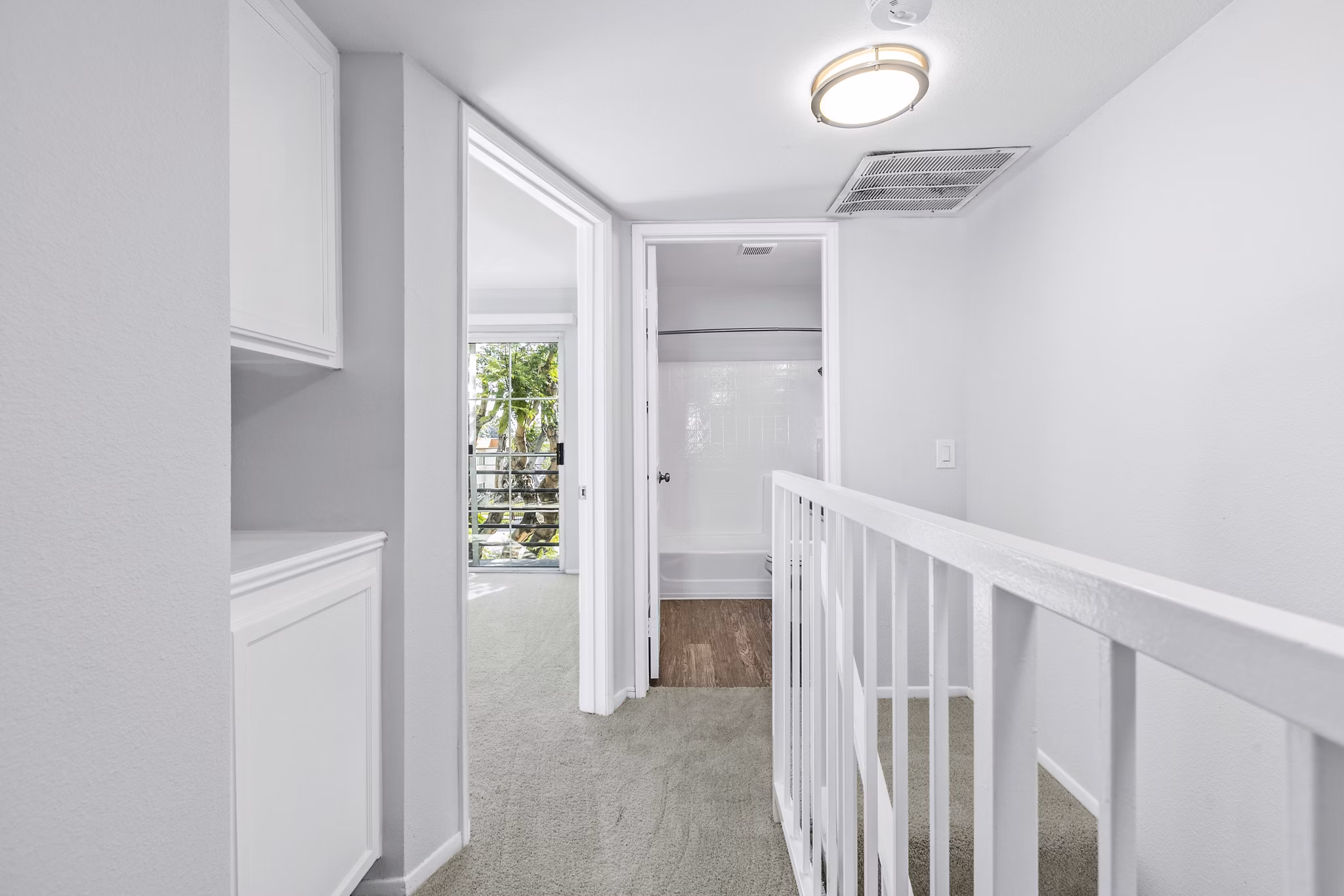 Nova Townhomes Apartments: Modern hallway and stairway design with sleek lines and ambient lighting
