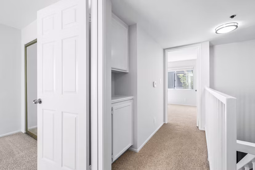Hallway and stairway with modern design at Nova Townhomes Apartments