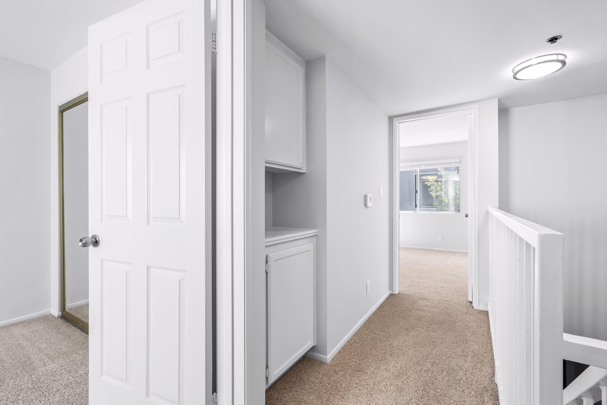Hallway and stairway with modern design at Nova Townhomes Apartments