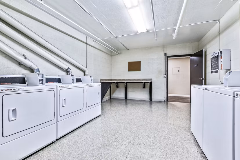 Convenient on-site laundry facility at Nova Townhomes Apartments offering modern amenities for residents
