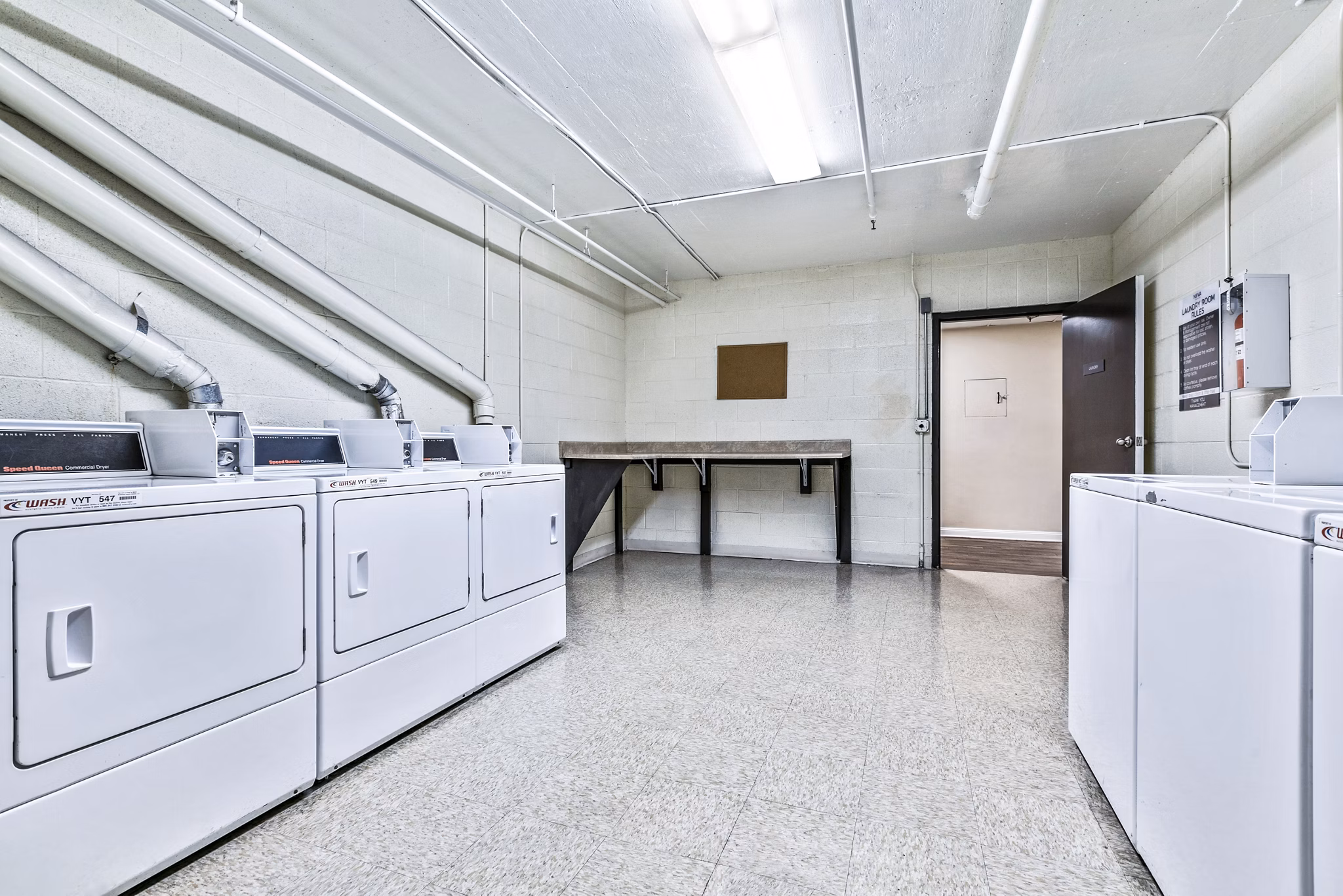 Convenient on-site laundry facility at Nova Townhomes Apartments offering modern amenities for residents