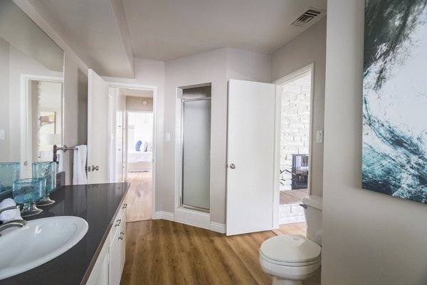 Bathroom featuring modern fixtures in Orange Grove Circle Apartments, luxury apartments by Greystar