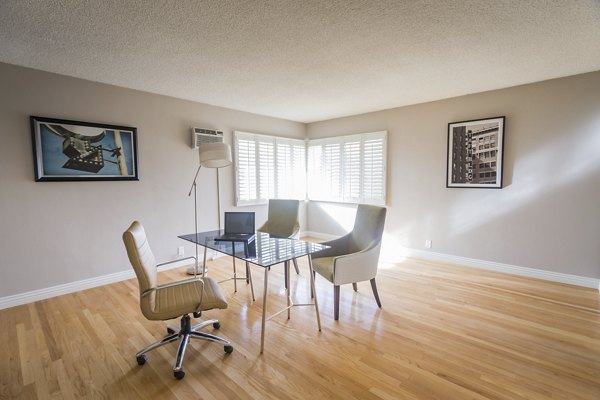 Home office featuring sleek desk and ergonomic chair at Orange Grove Circle Apartments
