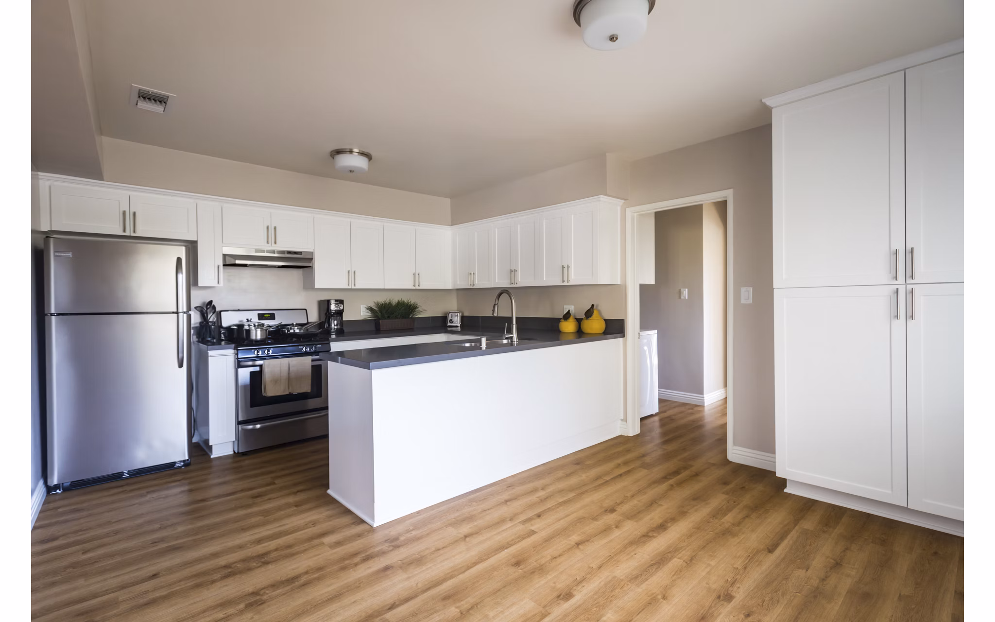 Modern kitchen with stainless steel appliances at Orange Grove Circle Apartments