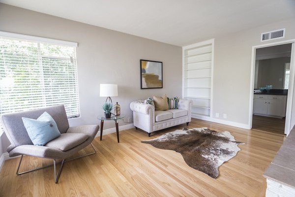 Spacious living room with modern decor at Orange Grove Circle Apartments