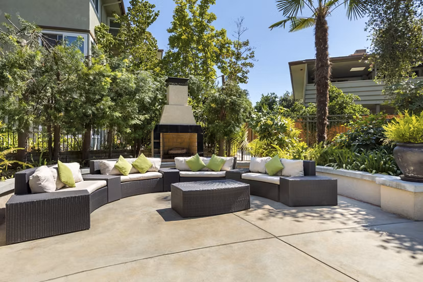 Relaxing outdoor pool with sun loungers at Orange Grove Circle Apartments, a luxury Greystar residence