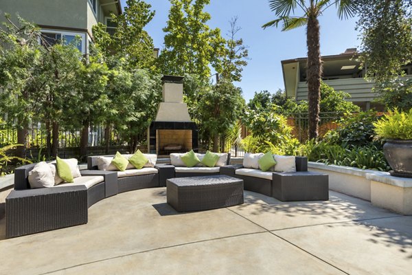 Relaxing outdoor pool with sun loungers at Orange Grove Circle Apartments, a luxury Greystar residence