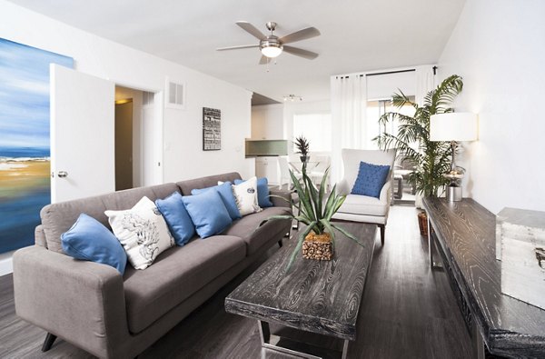 Spacious living room with modern decor at Pacific Rose Apartments