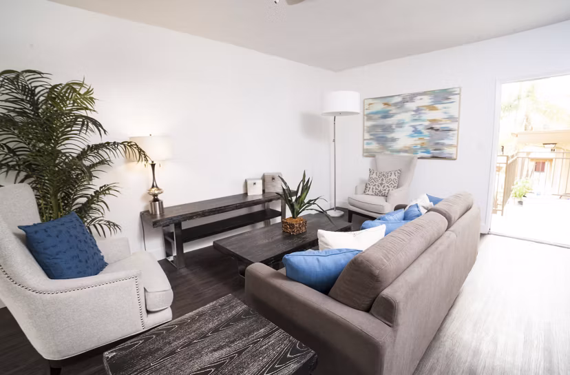 Spacious living room with modern furnishings at Pacific Rose Apartments, luxury high-rise apartments, perfect for city living and relaxation