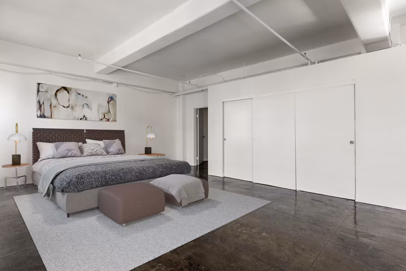 Spacious bedroom with modern decor at San Fernando Building Apartments in downtown Los Angeles