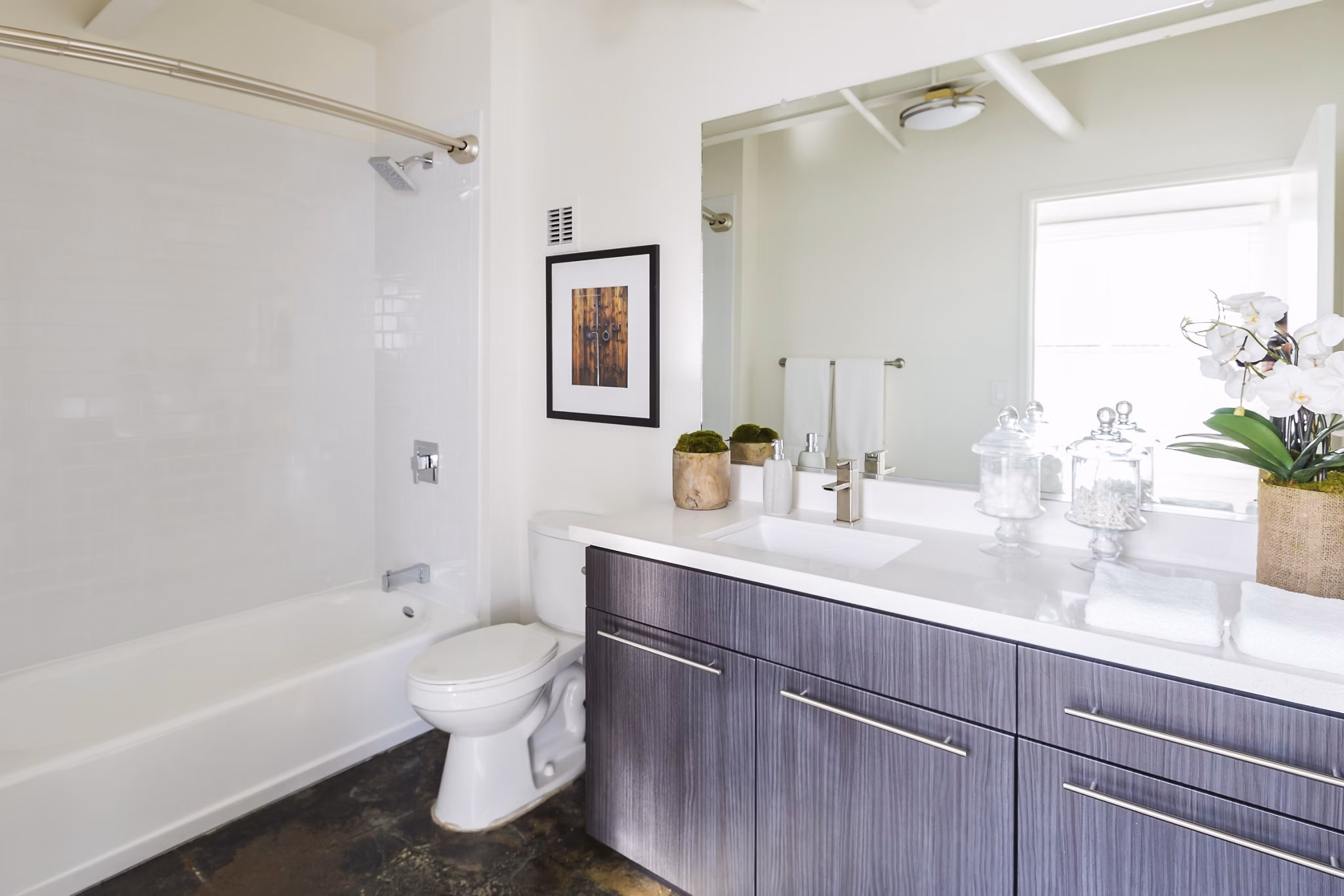 Bathroom featuring marble countertops and modern fixtures at San Fernando Building Apartments