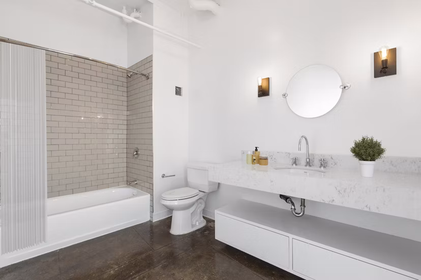 Modern bathroom with sleek fixtures at San Fernando Building Apartments in a Greystar luxury community