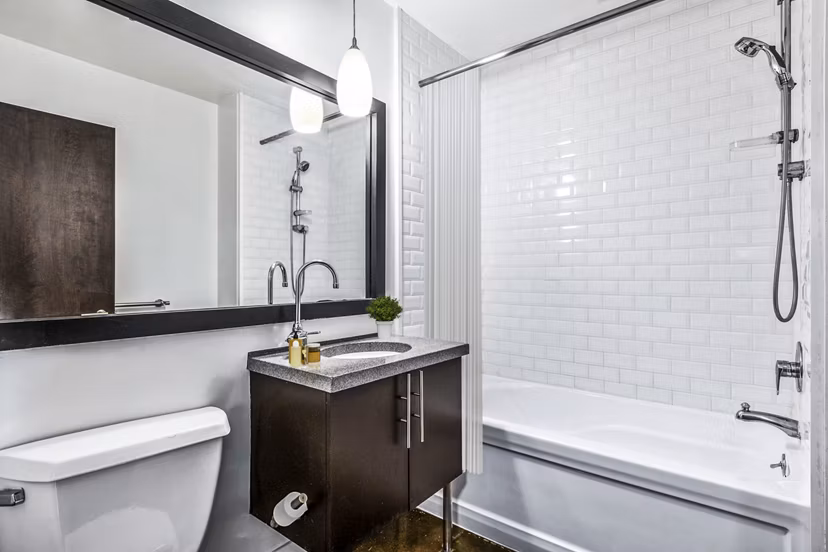 Elegant bathroom with marble countertops and modern fixtures at South Park Lofts Apartments, luxury living by Greystar