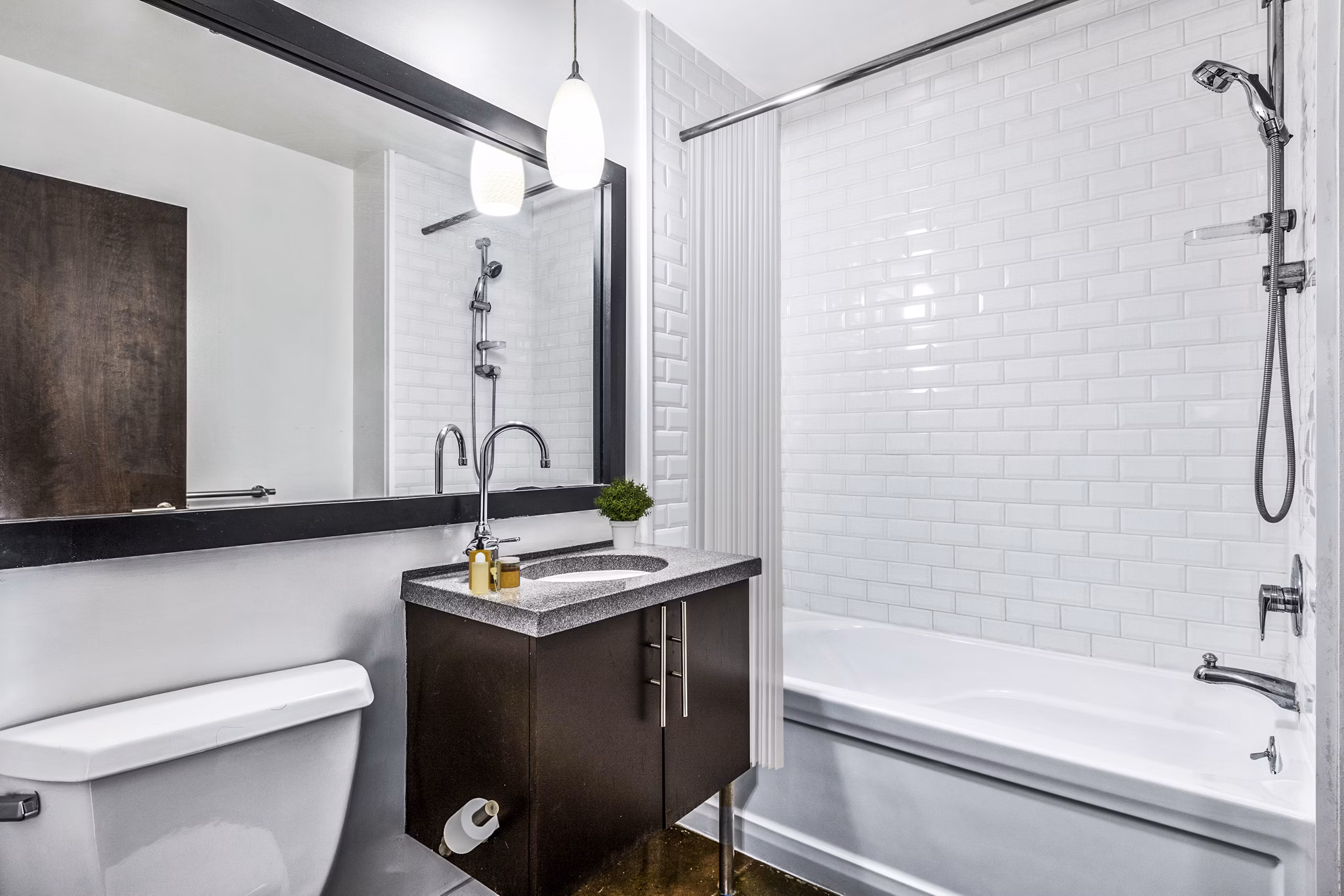 Elegant bathroom with marble countertops and modern fixtures at South Park Lofts Apartments, luxury living by Greystar