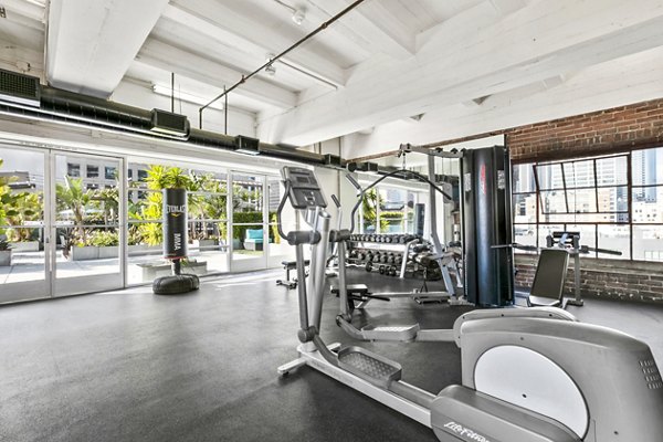 State-of-the-art fitness center at South Park Lofts Apartments featuring modern equipment and spacious workout areas