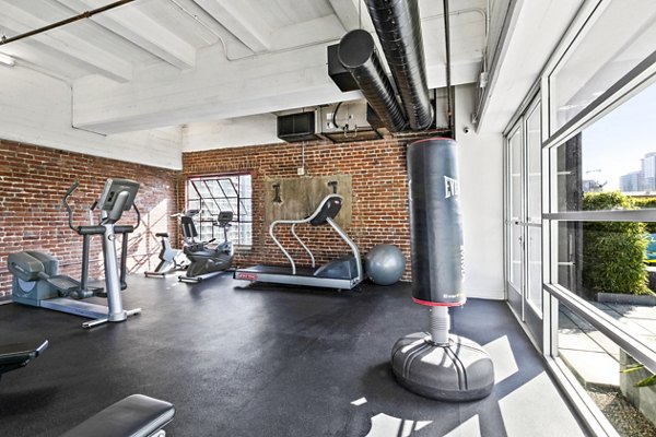 State-of-the-art fitness center with modern equipment at South Park Lofts Apartments, ideal for health enthusiasts