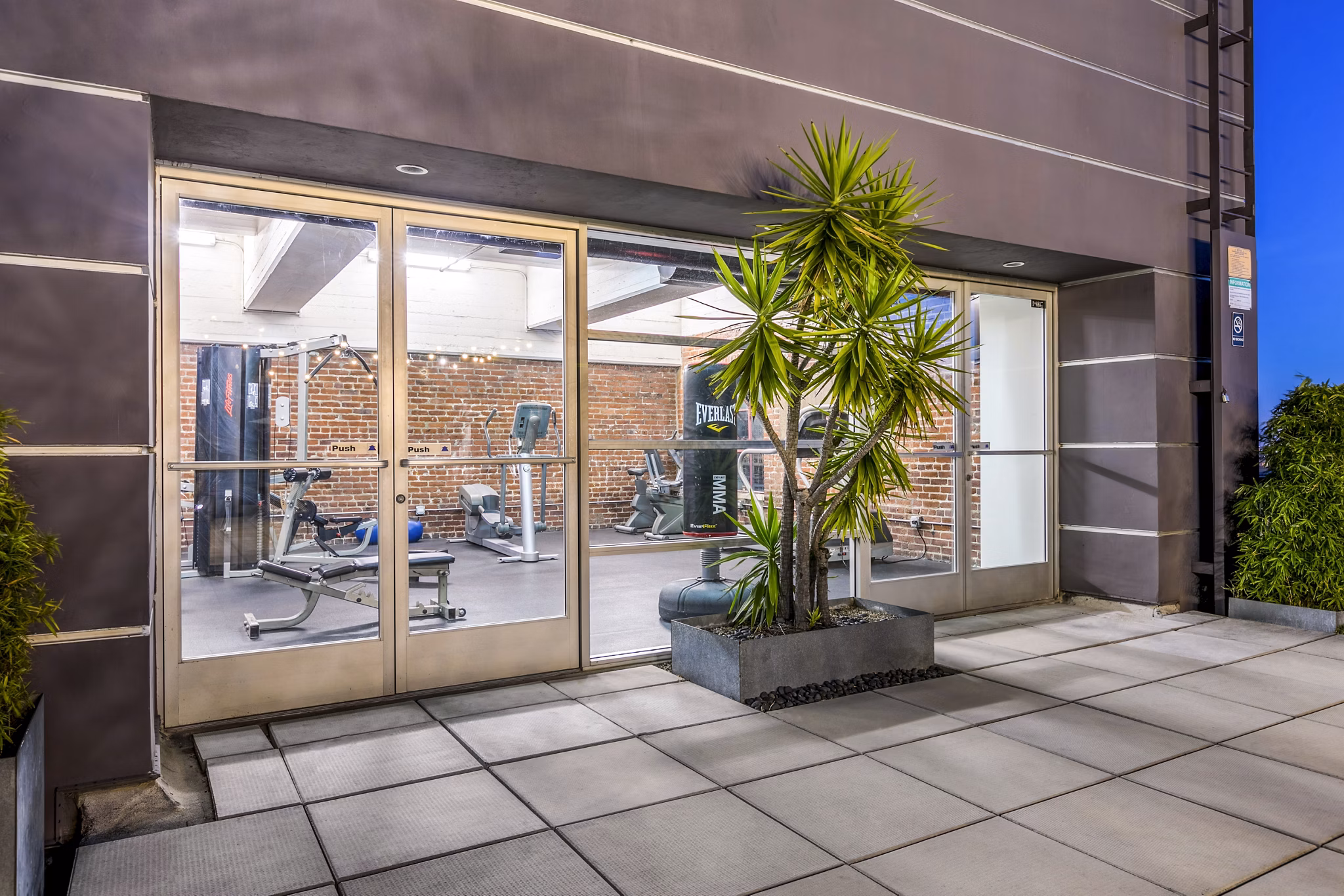 State-of-the-art fitness center at South Park Lofts Apartments featuring modern equipment and spacious design